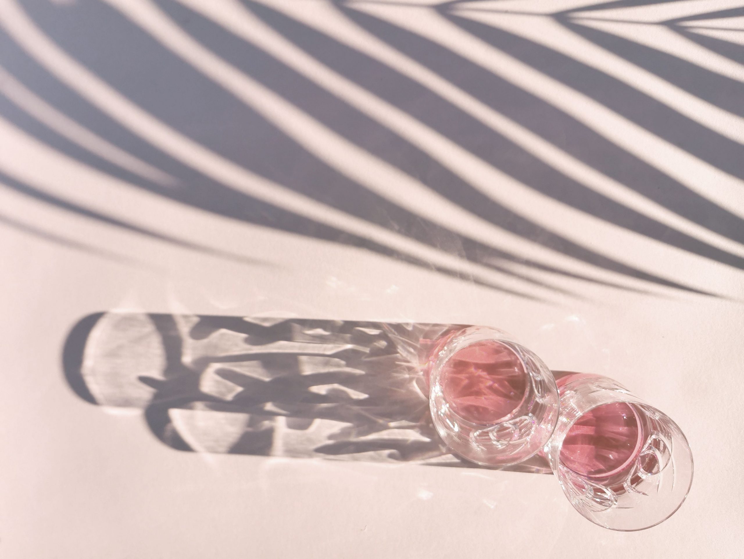 two glasses of pink beverages
